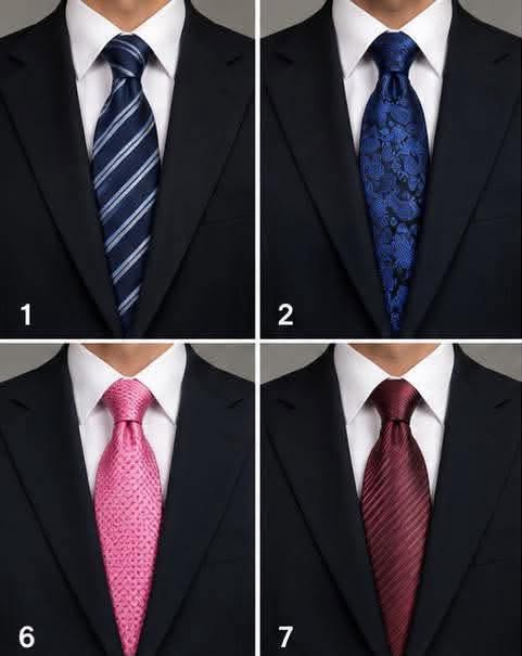 Four neckties in blue, pink, and burgundy styled with dark suits